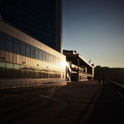 Railroad station platform against clear sky