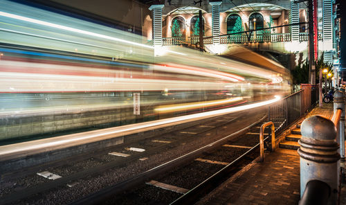 Light trails on railroad station at night