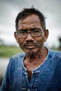 Portrait of senior man outdoors