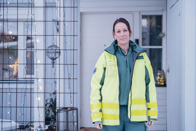 Ambulance staff in front of patient's home