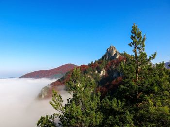 Scenic view of mountains against clear blue sky