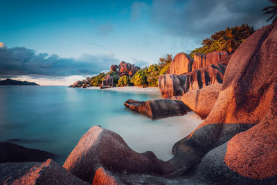 Panoramic view of sea and rock formation against sky