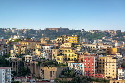 Aerial view of townscape against clear sky