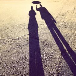 Shadow of people on wall