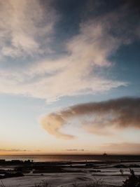 Scenic view of sea against sky at sunset