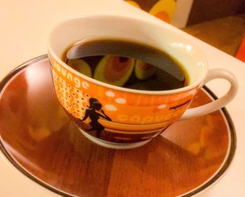 Close-up of tea cup on table