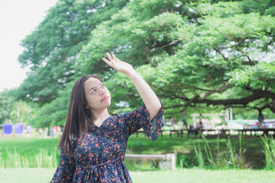 Young woman standing in park