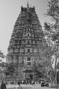 People at temple against clear sky