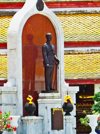 Statue of buddha outside building