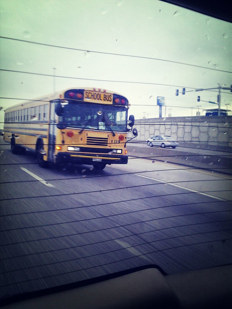 transportation, mode of transport, land vehicle, car, public transportation, train - vehicle, travel, railroad track, rail transportation, street, railroad station platform, sky, passenger train, railroad station, on the move, road, stationary, built structure, journey, no people