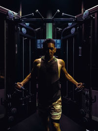 Portrait of man exercising at gym