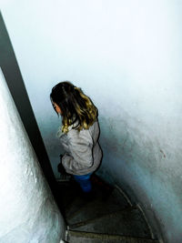 Boy standing in container