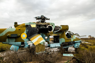 Abandoned vehicle on field
