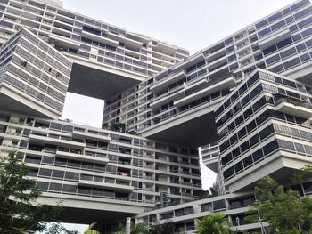 Low angle view of modern buildings against sky