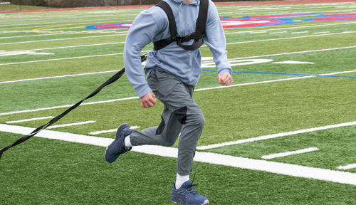 Full length of man running on grass