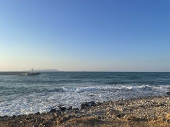 Scenic view of sea against clear sky