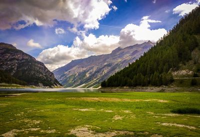 Scenic view of landscape and mountains against sky