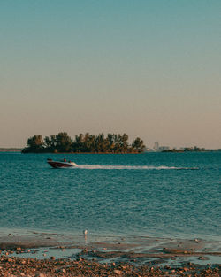 Scenic view of bay against clear sky