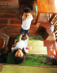 Portrait of siblings playing at home