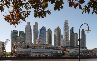 Modern buildings against sky in city