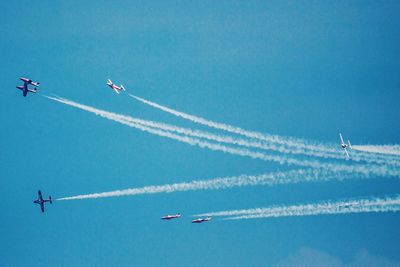 Low angle view of airplane flying in sky