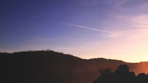 Scenic view of vapor trails in sky