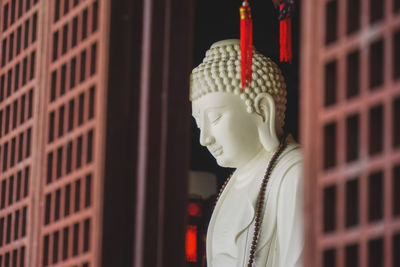 Close-up of statue against building