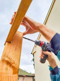 Low angle view of man working in workshop