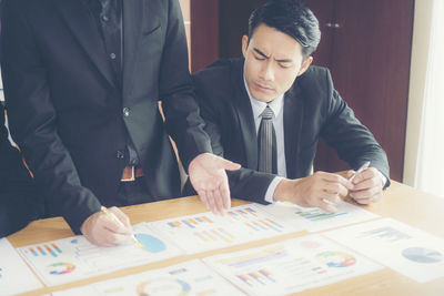 Business colleagues working at desk in office