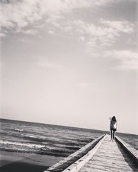 Man on beach against sky