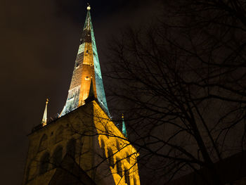 Low angle view of bell tower against sky at night