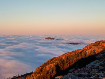 Scenic view of mountain against sky during sunset