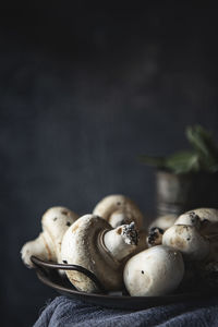 Close-up of mushrooms growing on table