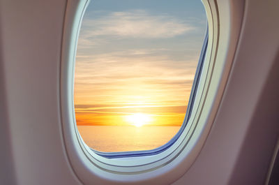 Sunset seen through airplane window