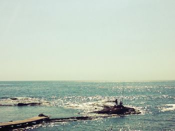 Scenic view of sea against clear sky