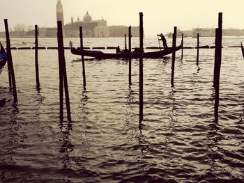 Wooden posts in sea