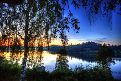 Scenic view of lake against sky during sunset