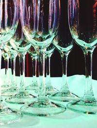 Close-up of wine glasses on table