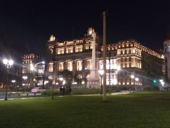 Illuminated buildings in city at night