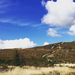 Countryside landscape against blue sky