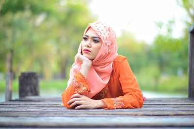 Portrait of a young woman looking away
