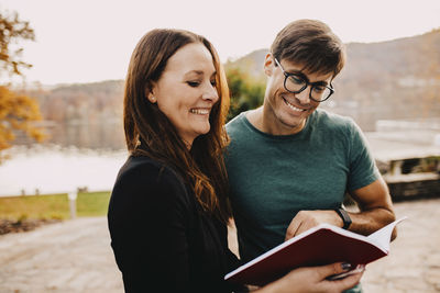 Portrait of young couple standing outdoors