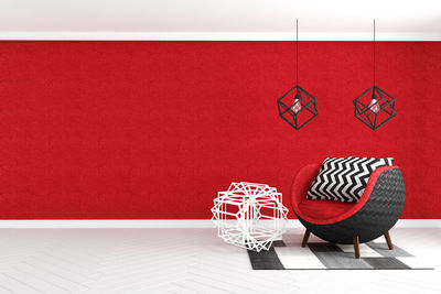 Empty chairs and table against wall at home