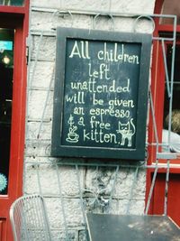 Close-up of information sign in restaurant