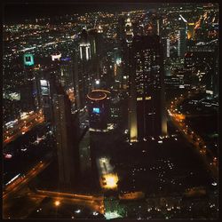 High angle view of illuminated cityscape at night