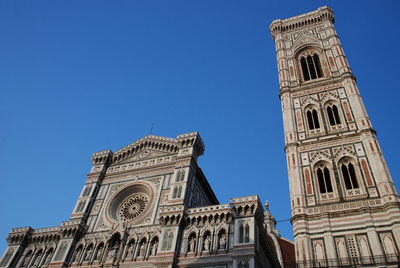 Low angle view of a building against blue sky