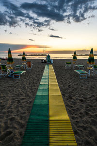 Scenic view of beach against sky during sunset