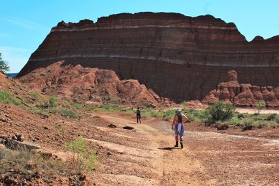Rear view of people walking at grand canyon national park