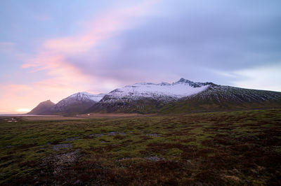 Scenic view of landscape against sky during winter