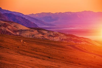 Scenic view of mountains against sky during sunset